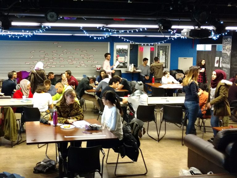 Students pack a lounge at Victoria College.