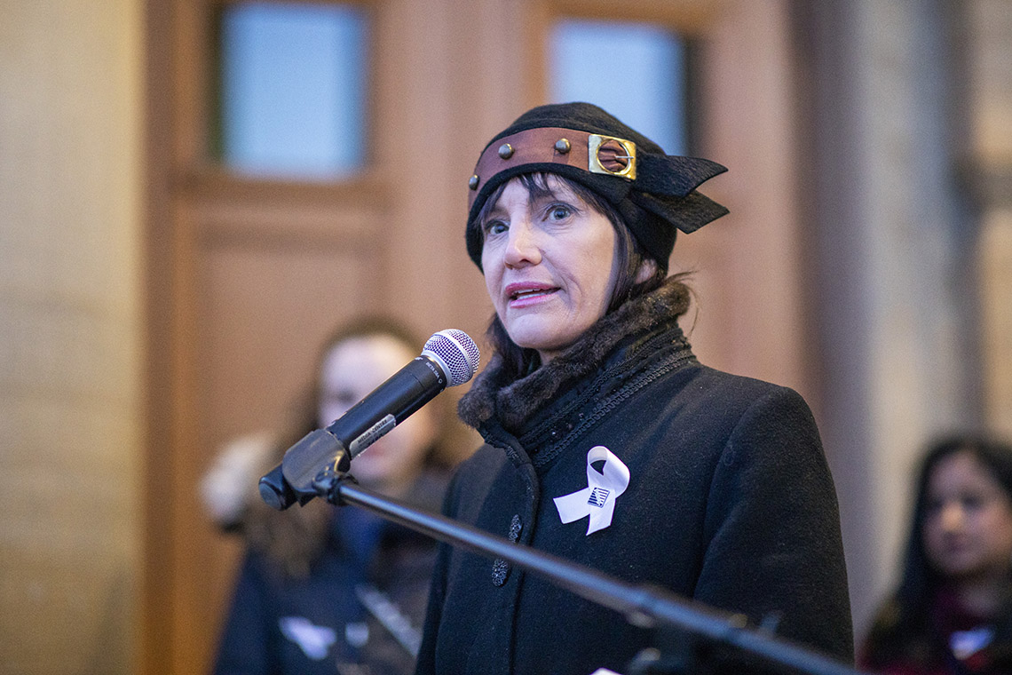 Marisa Sterling speaking into a microphone.