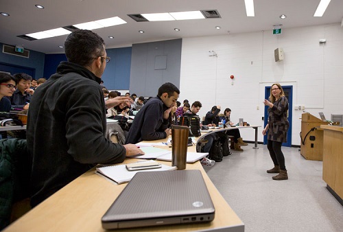 Diane Horton teaching computer science students in a lecture room.