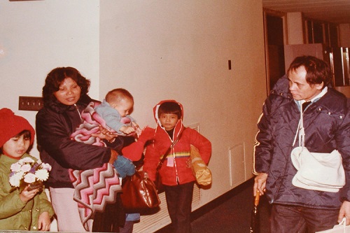 Family photo with children dressed for winter and their parents