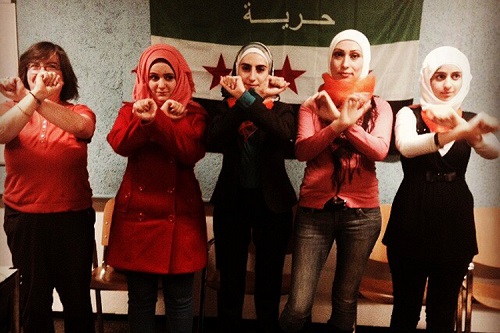 Noura Al-Jizawi with staff from Syria’s first regime-free publication