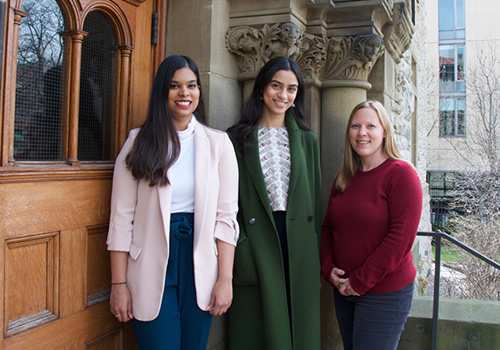 Kassandra Neranjan and Sakshi Shetty and Emily Hertzman standing on an outdoor step