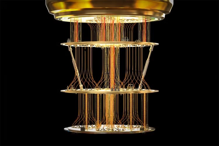A quantum computer showing gold disks attached with lines and coils.