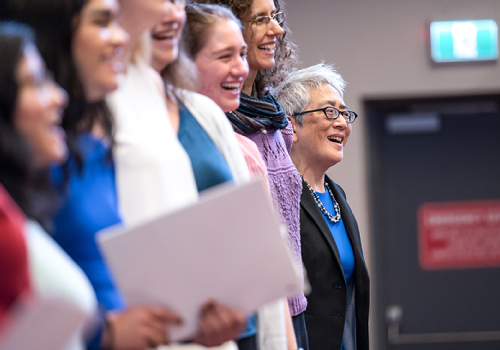 Carol Chan sings with the choir during her installation ceremony at Woodsworth College.