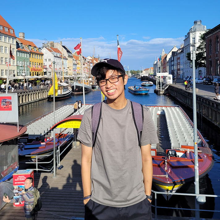Eric Chiu standing in front of boats outdoors