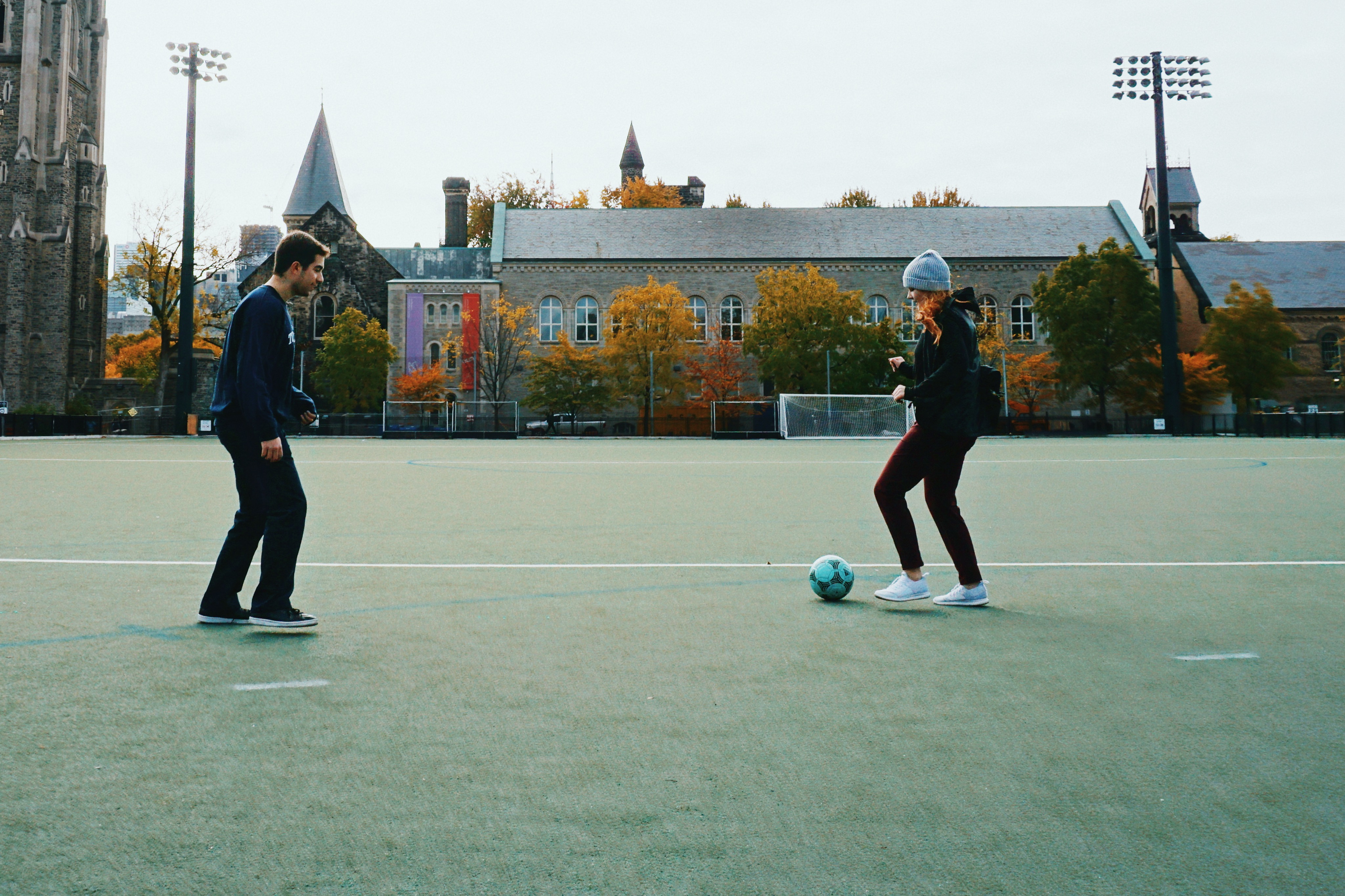 Students playing soccer in back campus fields