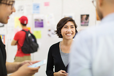 students chatting in career fair