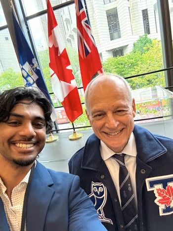 Liam Dravid and President Meric Gertler.