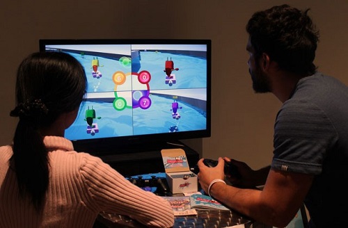 Two students playing a video game