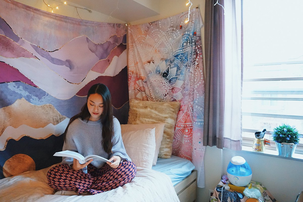 Student reading in her residence room