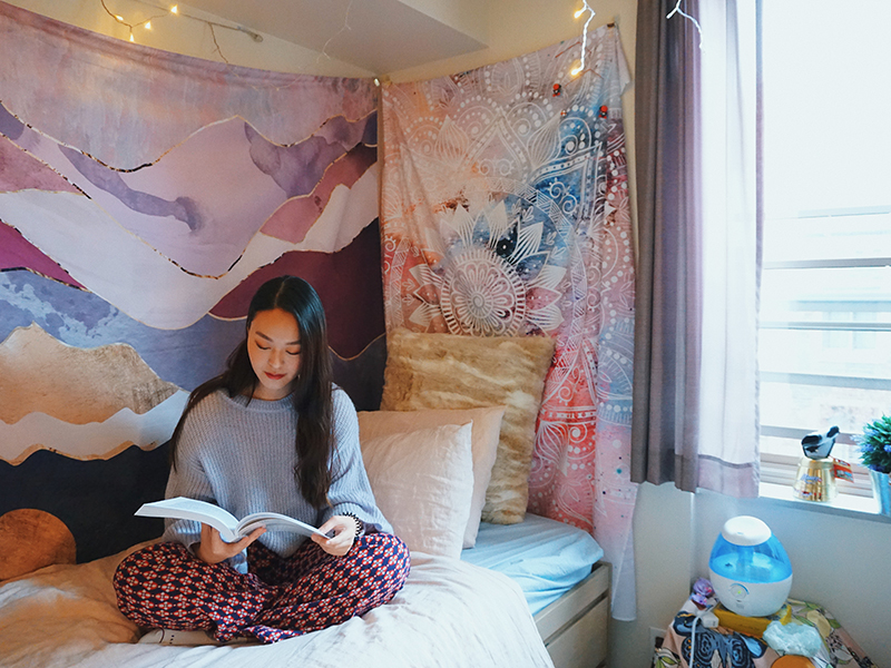 Student reading in her residence room