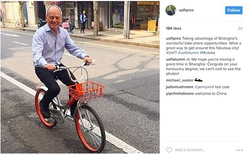 Meric Gertler's Instagram post showing him riding a bicycle on the streets of Shanghai