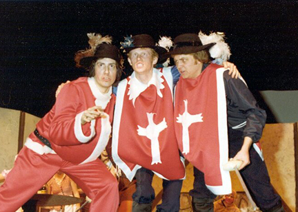Rob West in middle of two men - all dressed as the Three Musketeers
