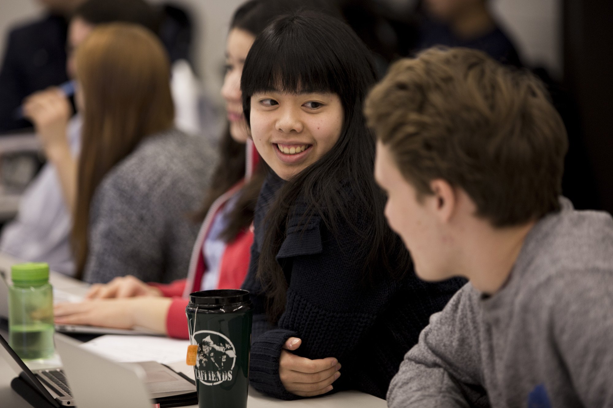 Photo of two students talking to each other