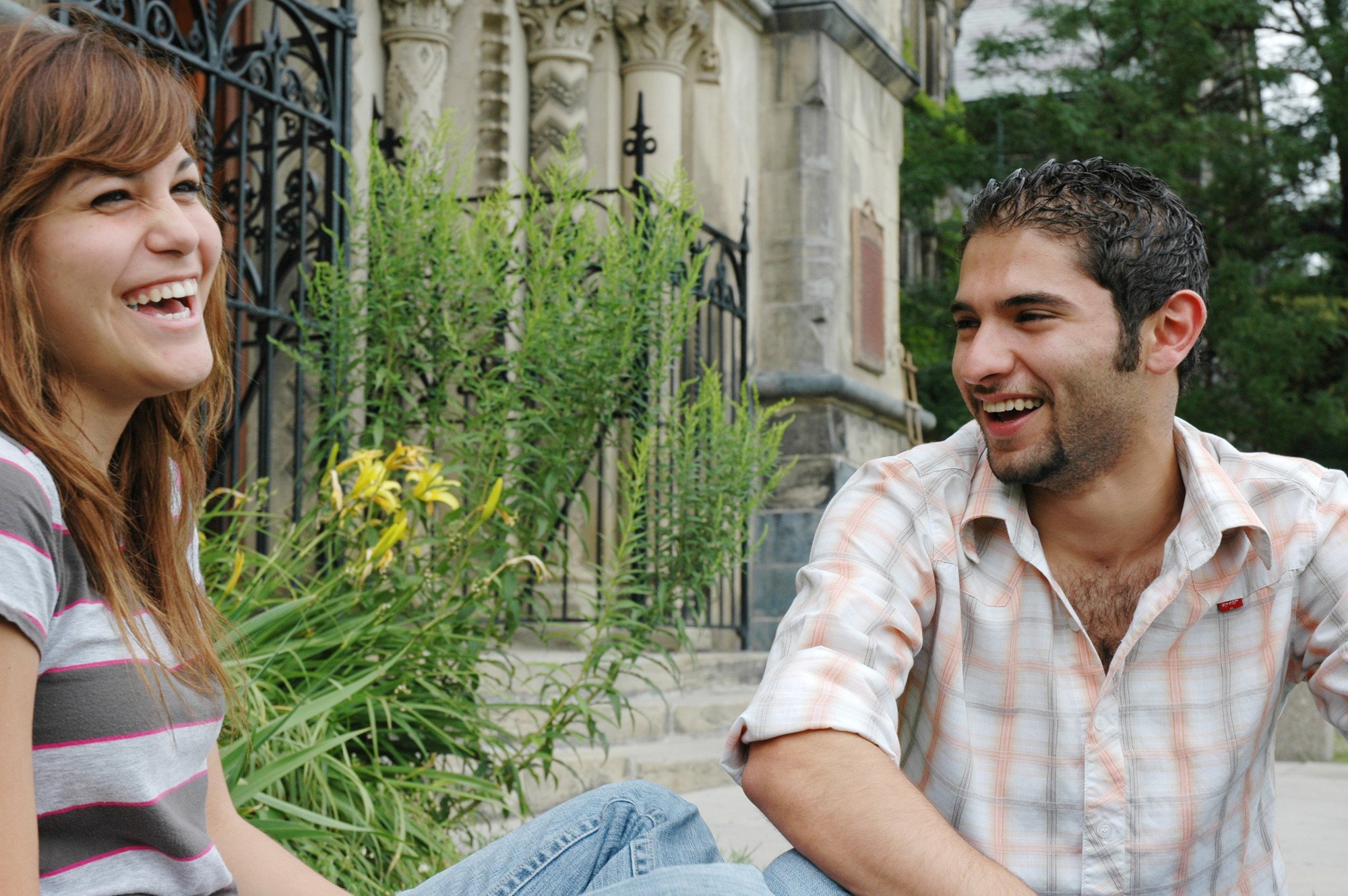 Photo of two students talking to each other