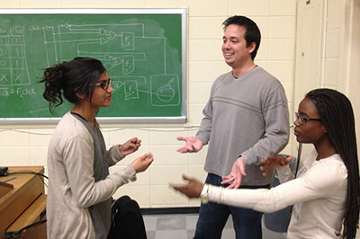 Professor Steve Engels discusses class materials with students