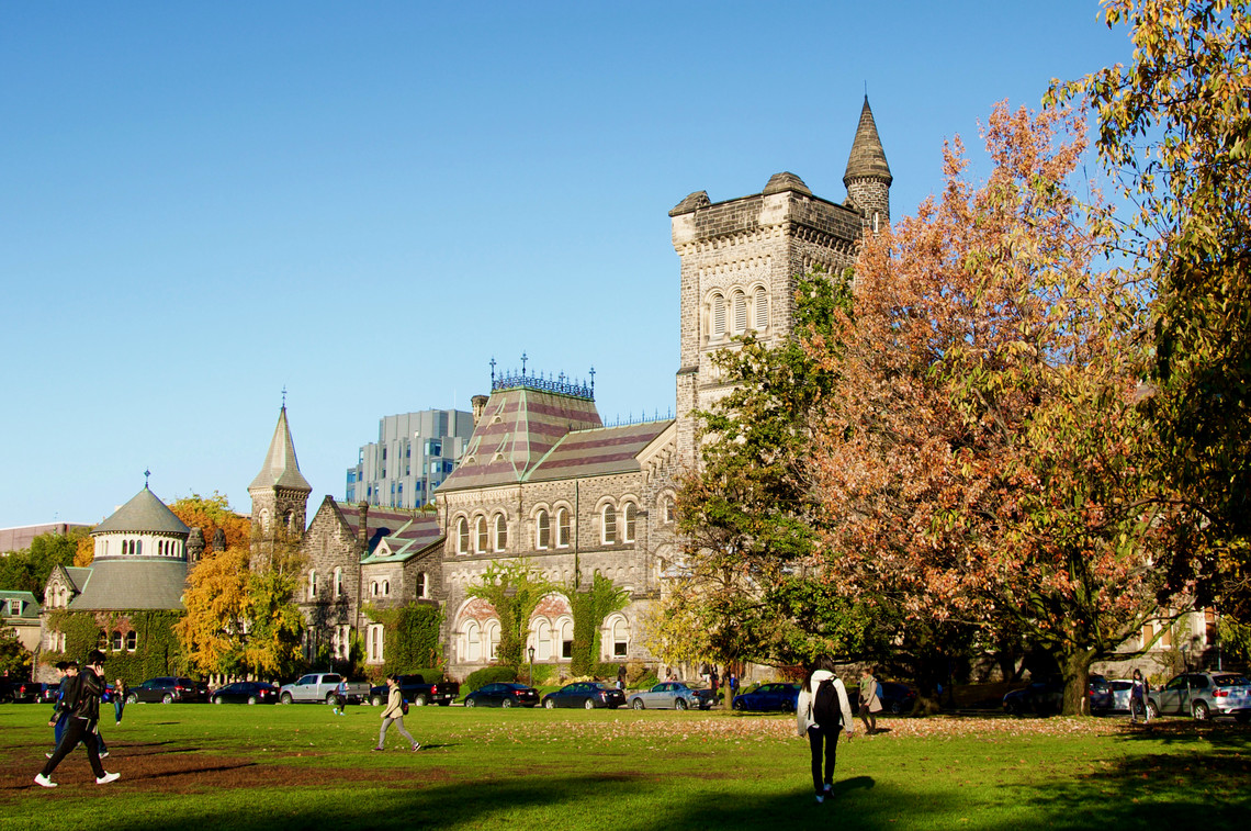Students walking in front of University College in fall