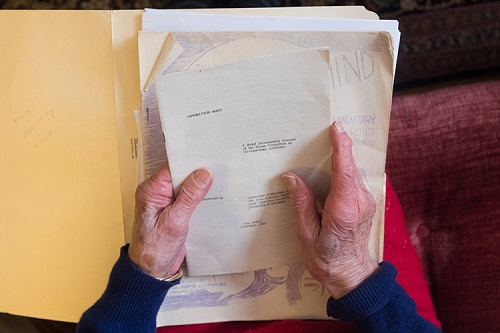 A picture of Zemon Davis's hands holding a copy of the pamphlet “Operation Mind.”