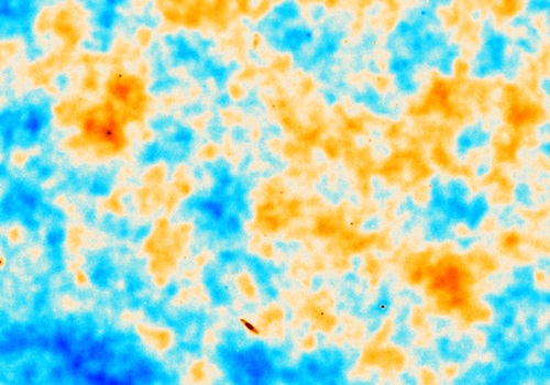 An ACT/Planck image of the CMB showing a patch of sky about 20 times the width of the moon. The orange shows regions of gas at a higher density; blue, less dense. 