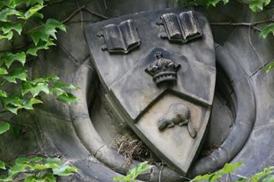 A photo of U of T crest statue in a building on campus