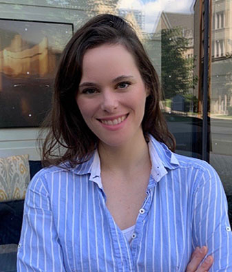 Headshot of Alexandra Decker wearing blue striped shirt