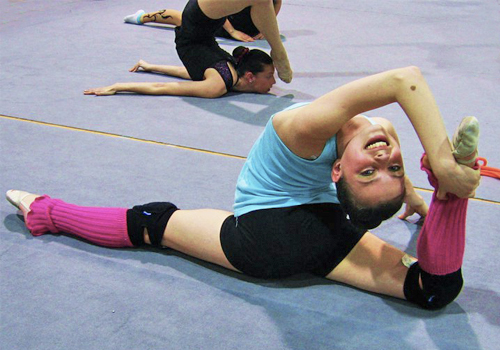 Anna Paliy contorted and stretching on the floor