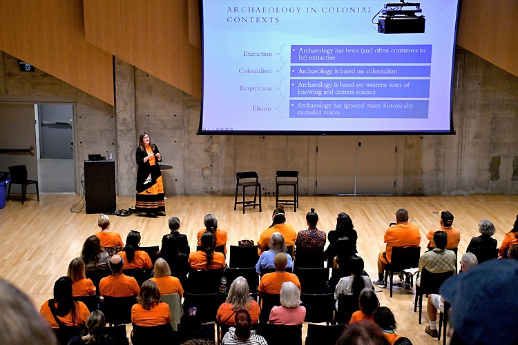 An audience watching K Supernant speaking