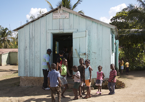 Group of children outside a bateye