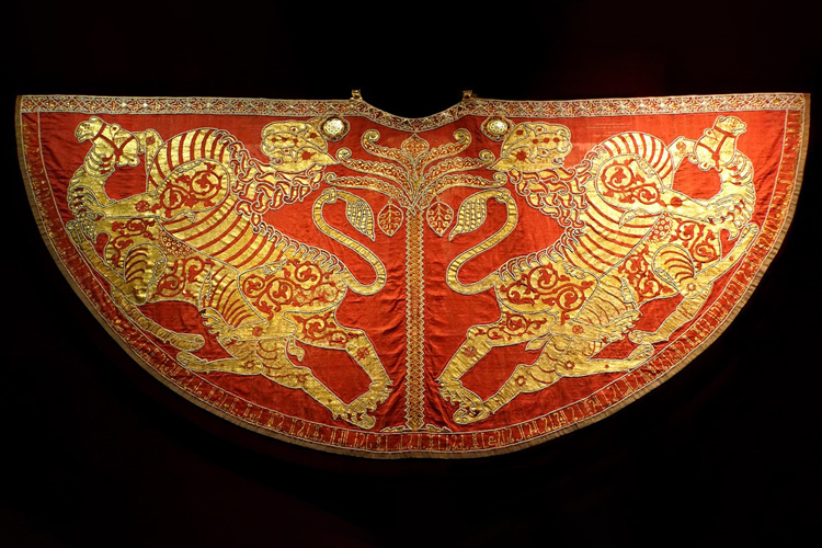 An ornate red and gold textile
