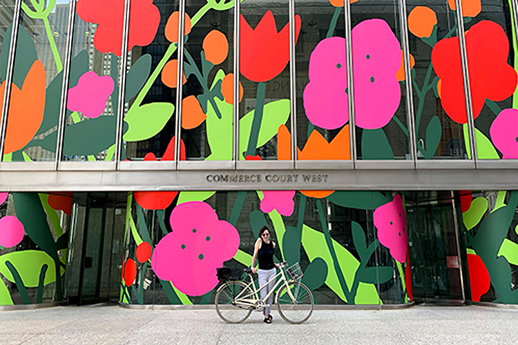 A mural painting of red and pink blooming flowers.