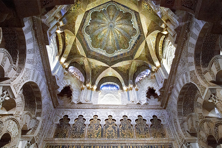 Looking up at a beautiful dome in an ancient mosque