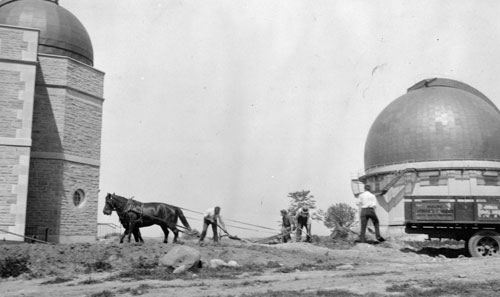 An image of the Dunlap conservatory with a horse and plow.