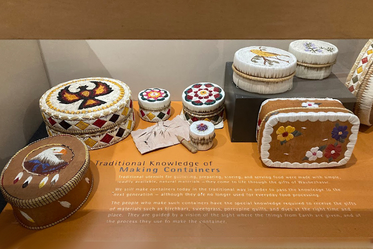 Containers made from materials like sweetgrass and birchbark.