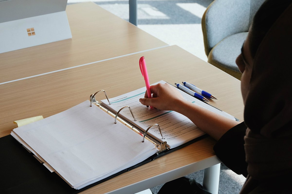 student planning courses on a notebook