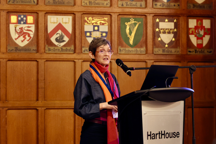 Antoinette Handley speaking at a podium.