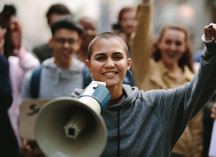 A close-up of a young person at a protest.