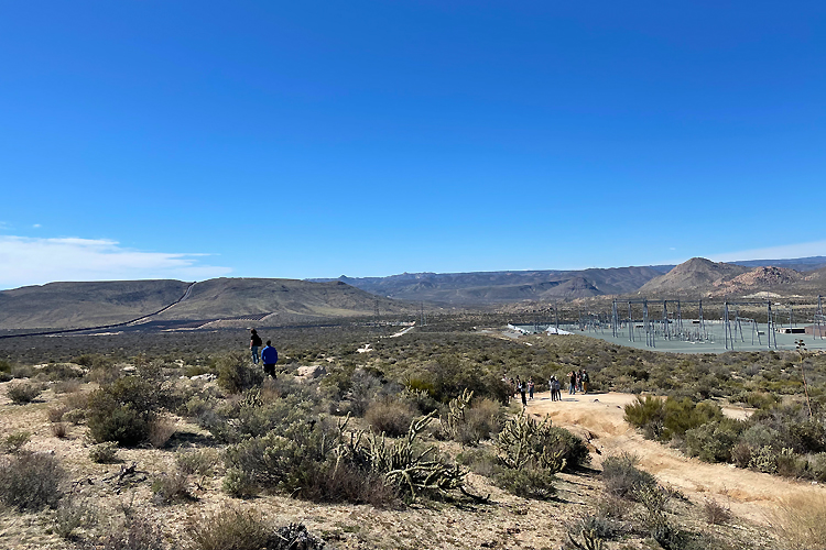 A landscape of a dessert under a bright blue sky.