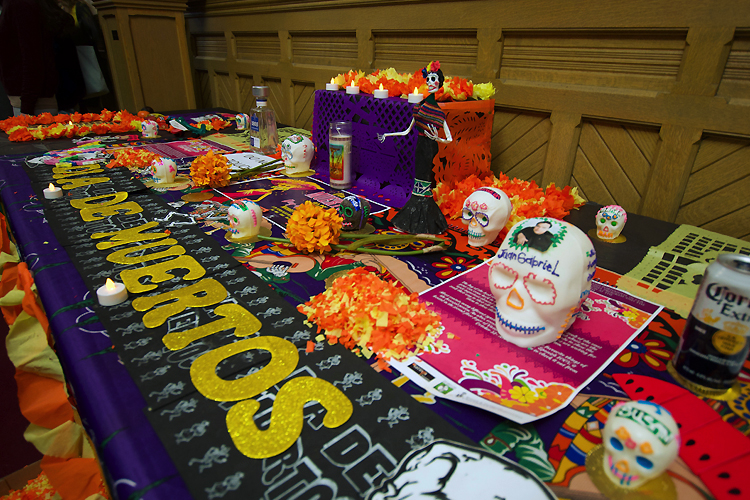 A table with various Day of the Dead decorations