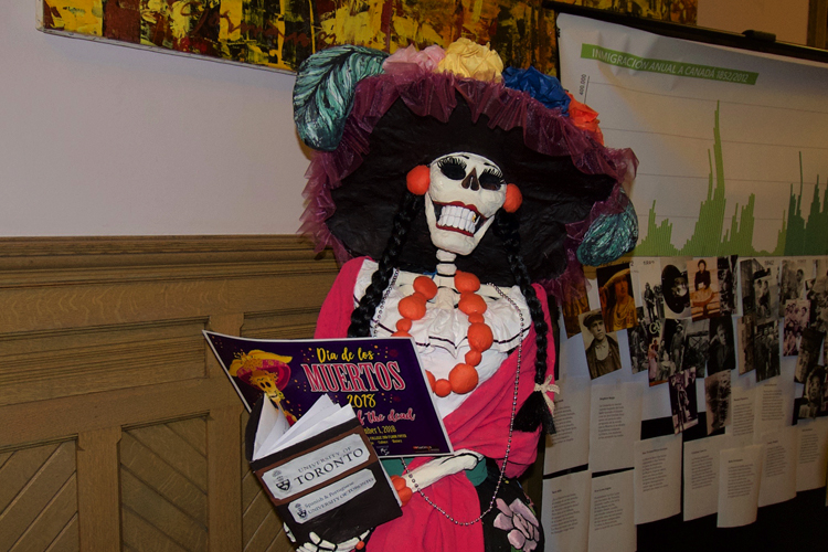 Catrina, an icon of the Day of the Dead. She looks like a skeleton with dramatic makeup.