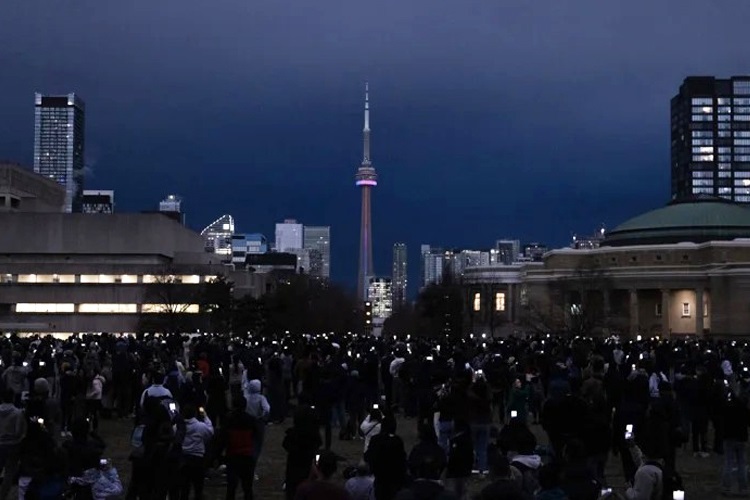 On U of T’s St. George campus, hundreds watched as the moon’s shadow darkened the mid-day sky during the April solar eclipse