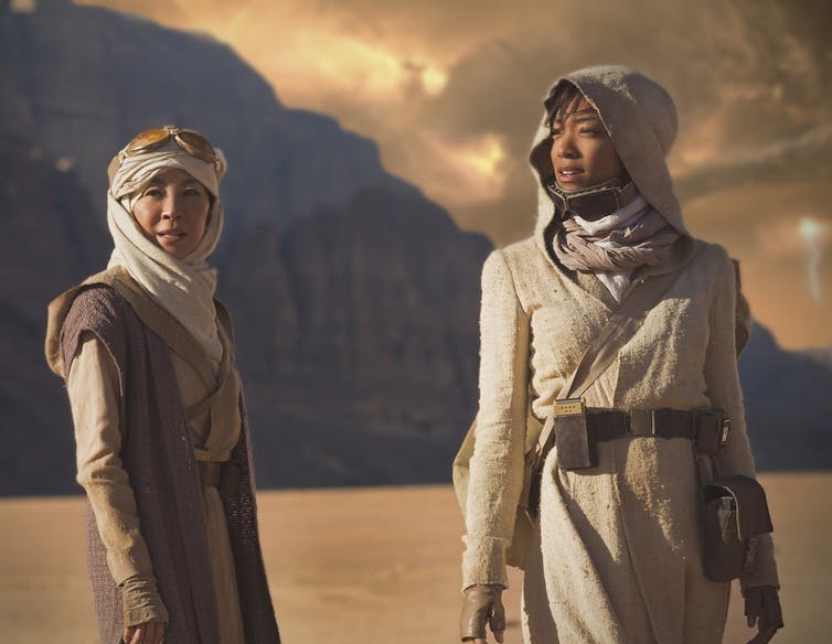 A still from Star Trek: Discovery; two women stand on a desert planet