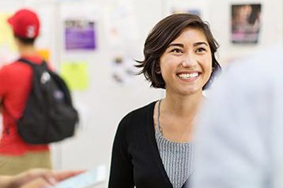 A happy student in conversation with her mentor