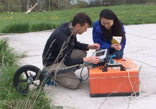 Students with ground-penetrating radar equipment