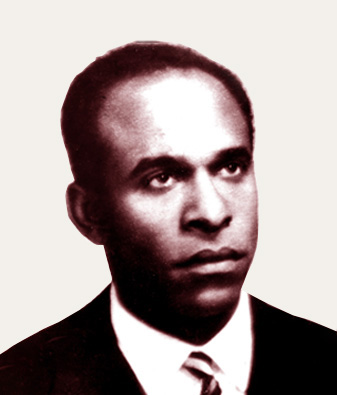 Black and white headshot of Frantz Fanon