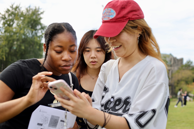 Three students review temperature measurements.