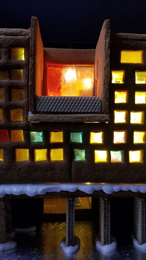 close up New College III residence in gingerbread - illuminated