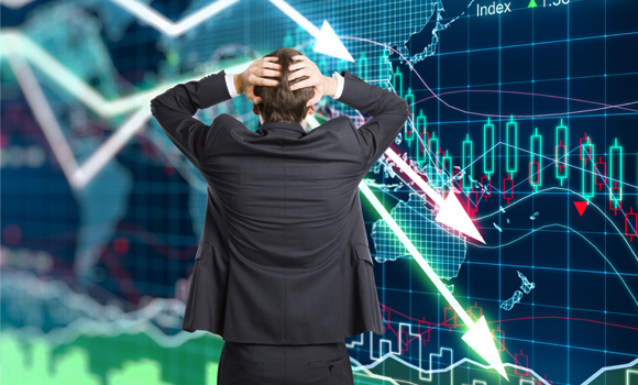 Distressed man watching a stock market crash on a screen