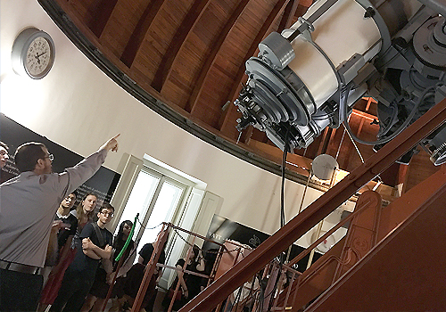 Adam Hincks leading a group of St. Mike's students on a tour of the Vatican Observatory.