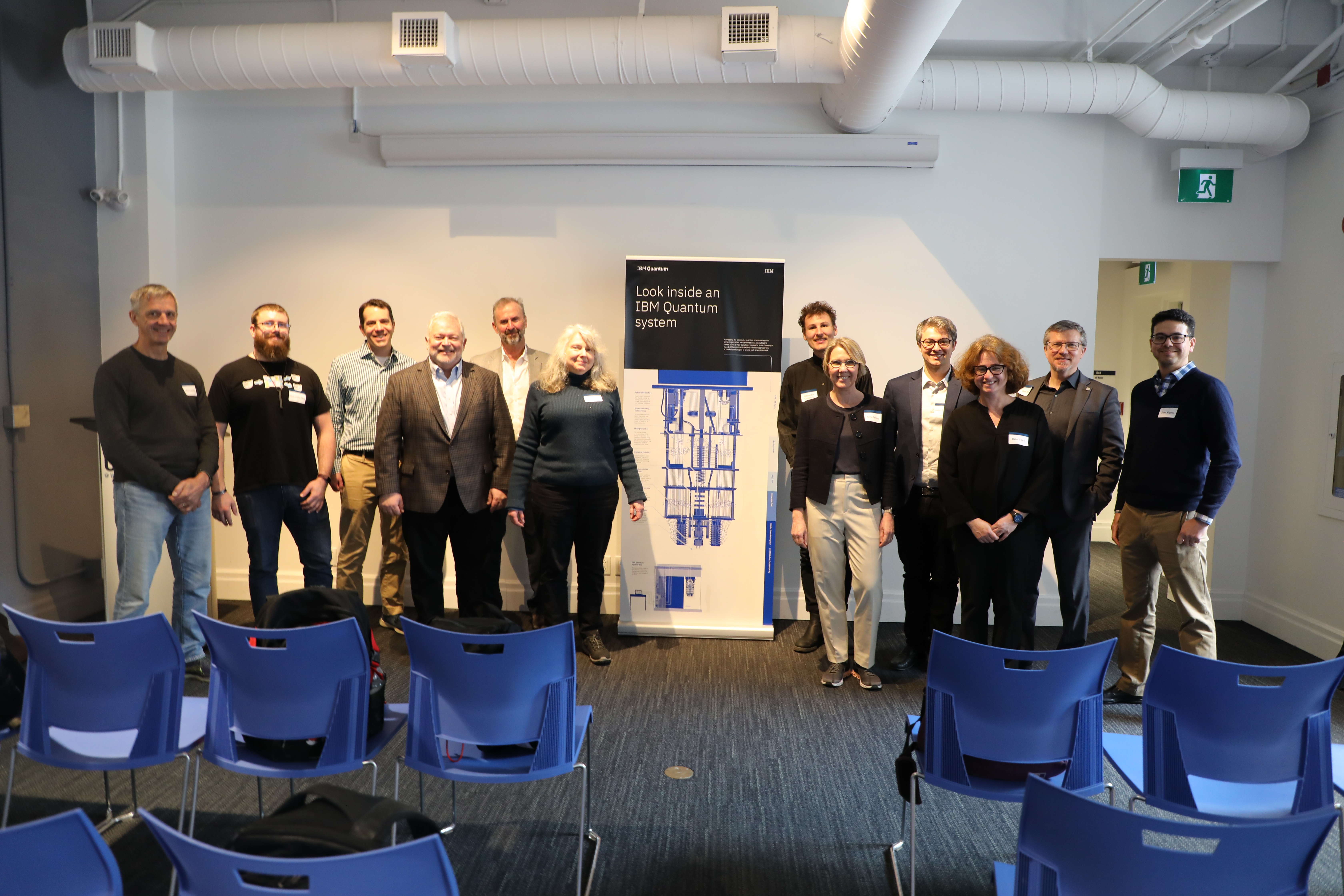 Several people posing at a conference