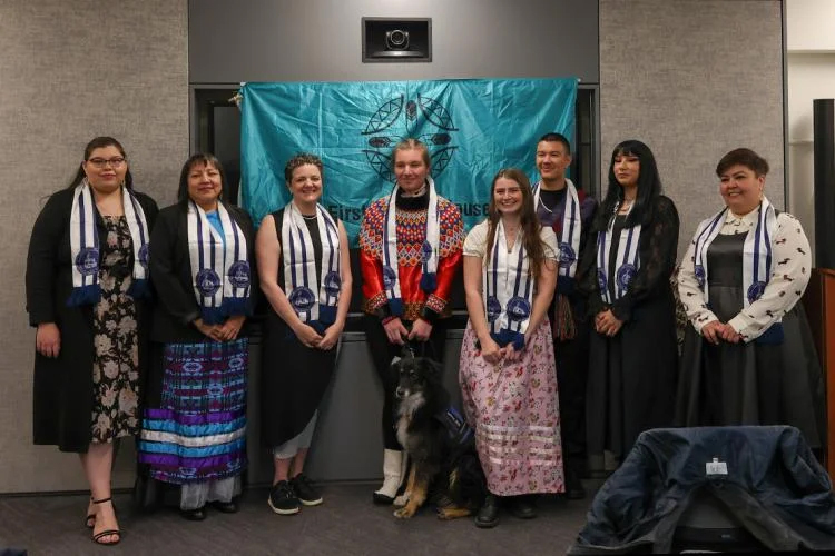 Corbiere, fourth from right, poses for a group photo at the Indigenous Graduation celebration at First Nations House